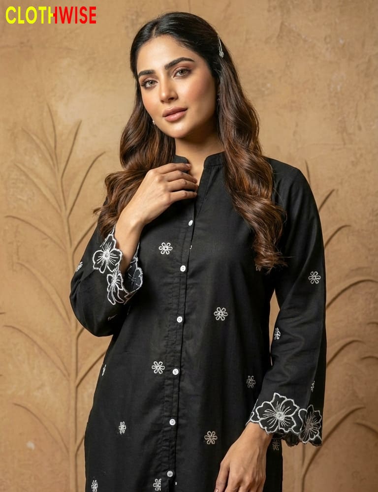 Woman wearing a black embroidered kurta against a beige background with 'Clothwise' branding.