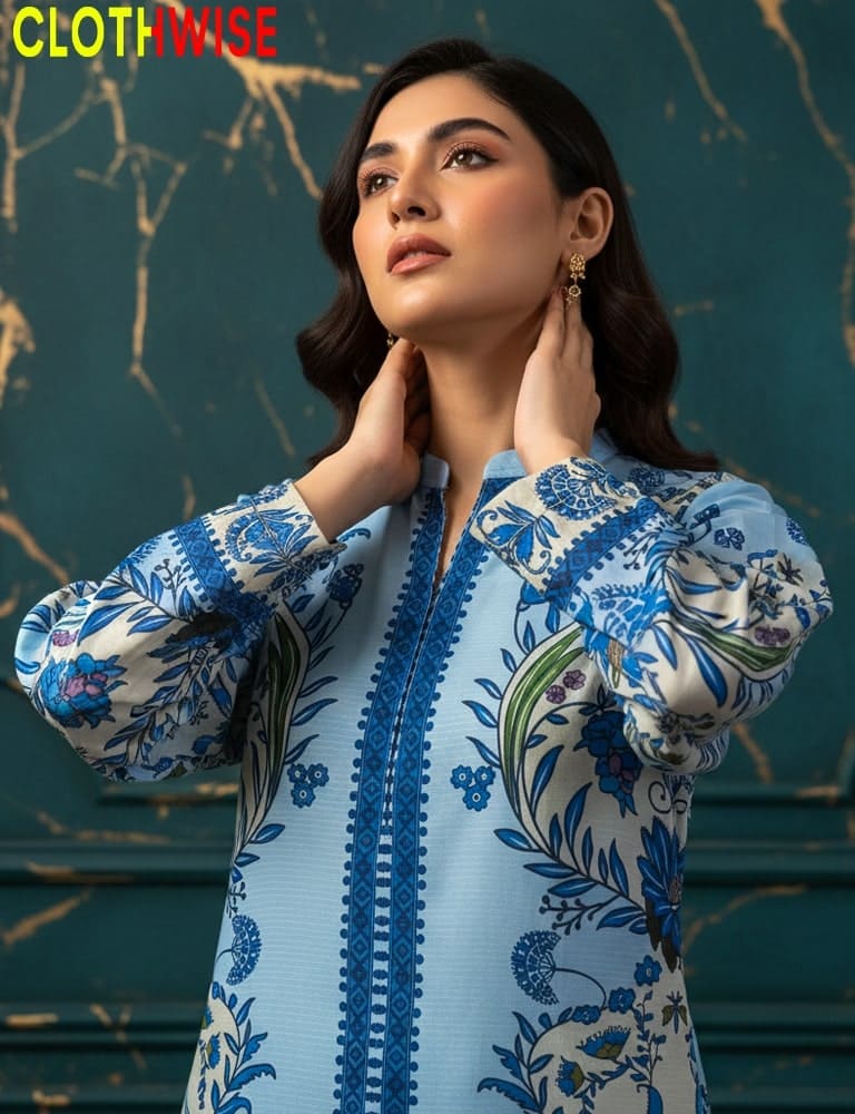 Woman wearing a blue and white floral embroidered outfit with 'CLOTHWISE' branding.