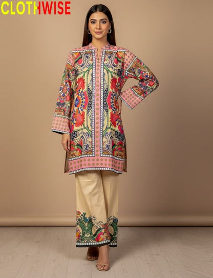 Woman wearing a colorful embroidered outfit with 'CLOTHWISE' branding.