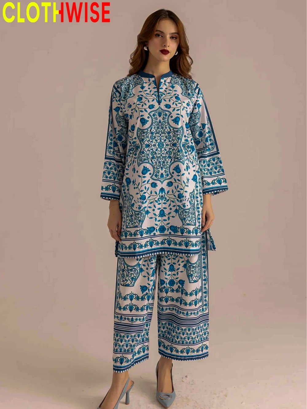 Woman wearing a blue and white patterned outfit with 'CLOTHWISE' branding.