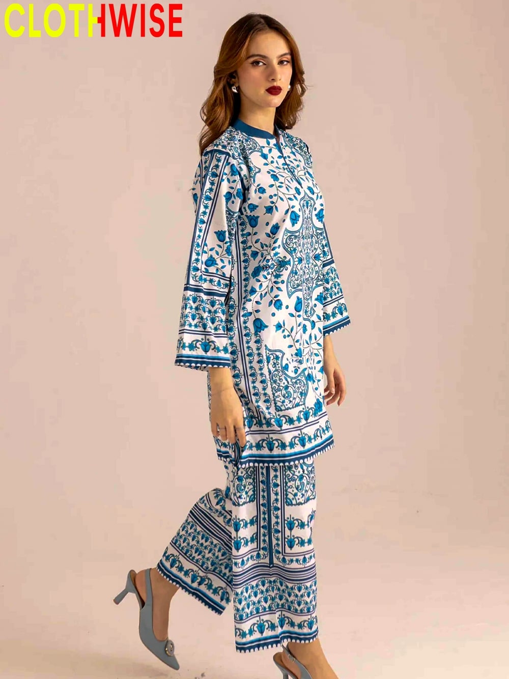 Woman wearing a blue and white patterned outfit with 'CLOTHWISE' branding.