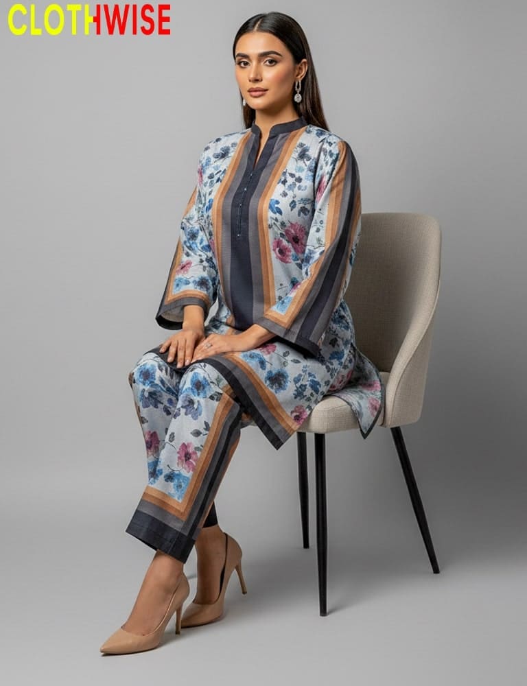 Woman sitting on a chair wearing a floral outfit with 'CLOTHWISE' branding.