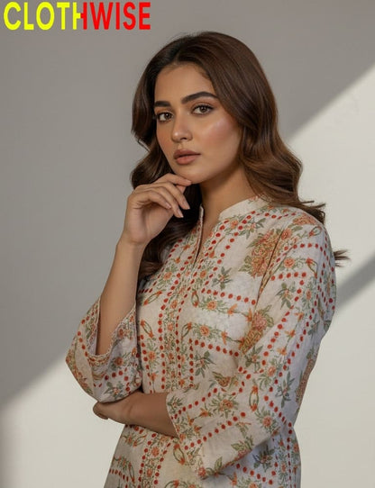 Woman wearing a floral patterned outfit with 'CLOTHWISE' branding.