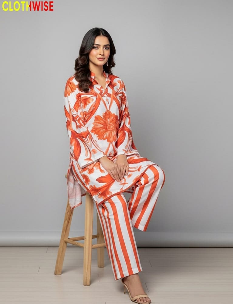 Woman sitting on a stool wearing an orange and white floral outfit with striped pants, brand 'CLOTHWISE' visible.