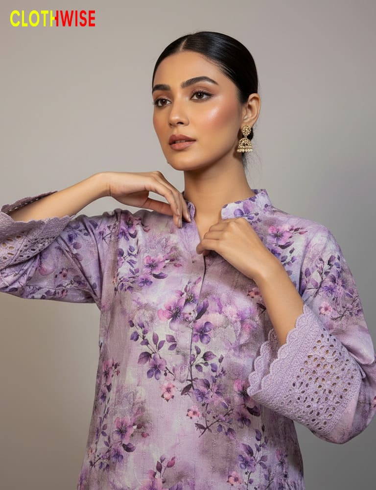 Woman wearing a purple floral dress with 'CLOTHWISE' branding.