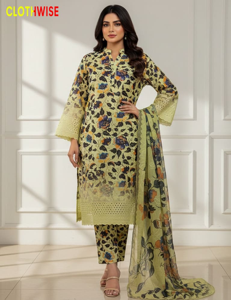 Woman wearing a green floral dress with a matching dupatta in a well-lit room.