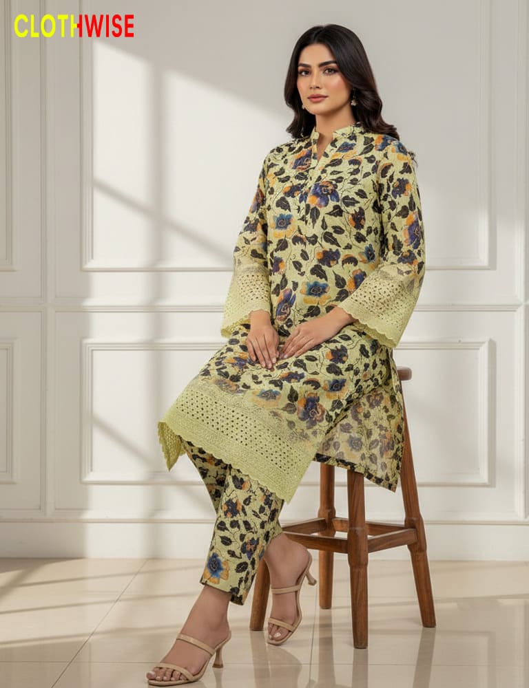 Woman sitting on a stool wearing a green floral dress with 'Clothwise' branding.