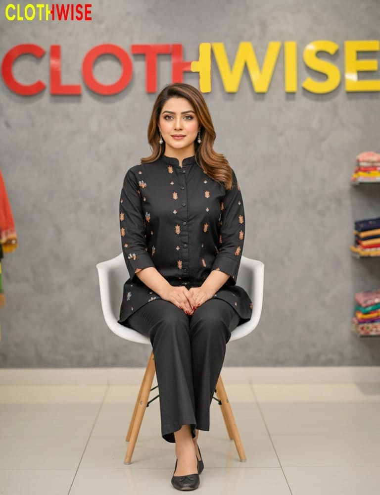 Woman sitting on a chair in front of a 'Clothwise' branded wall.