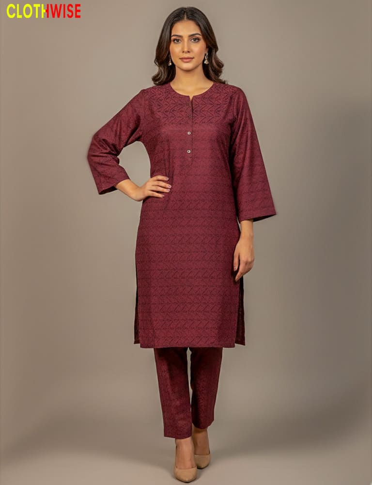 Woman wearing a maroon kurta with pants on a gray background, with 'Clothewise' branding.