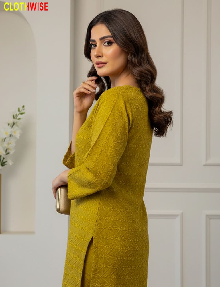 Woman wearing a mustard yellow dress with a blurred background