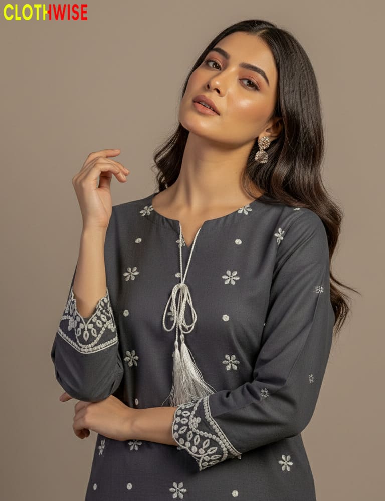 Woman wearing a dark gray traditional outfit with floral patterns on a beige background, branded 'Clothwise'.
