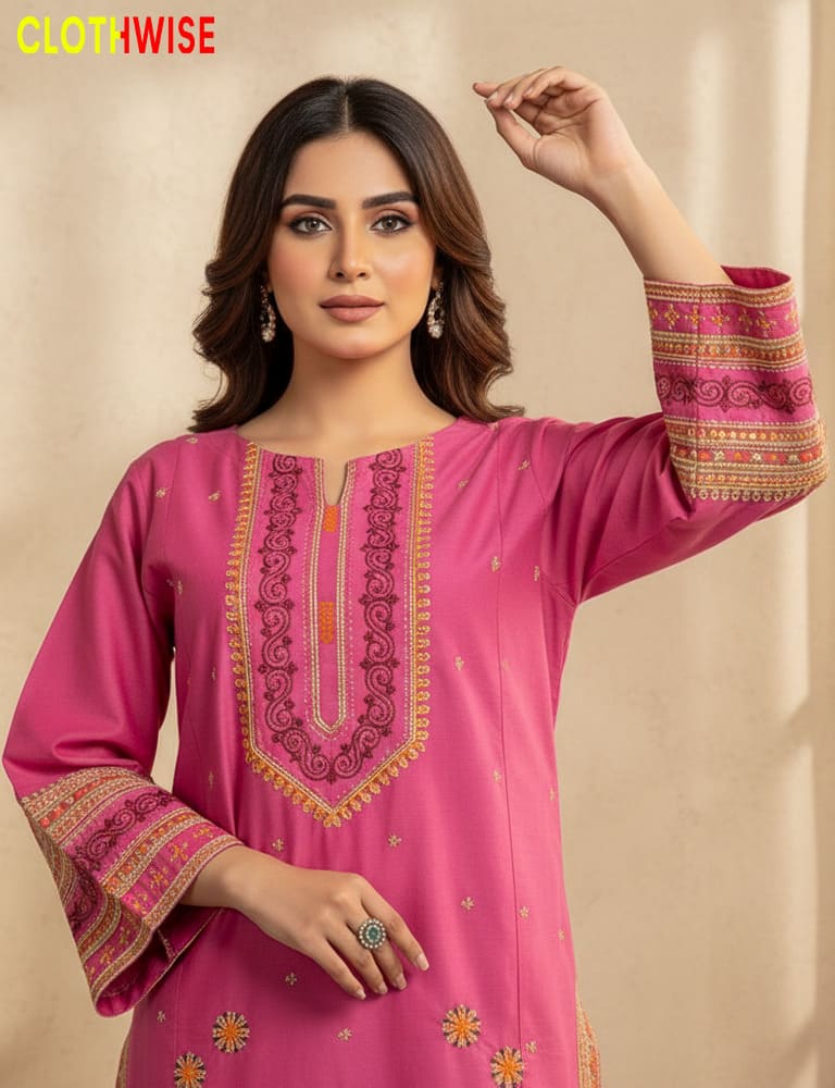 Woman wearing a pink embroidered traditional outfit with 'CLOTHWISE' branding.