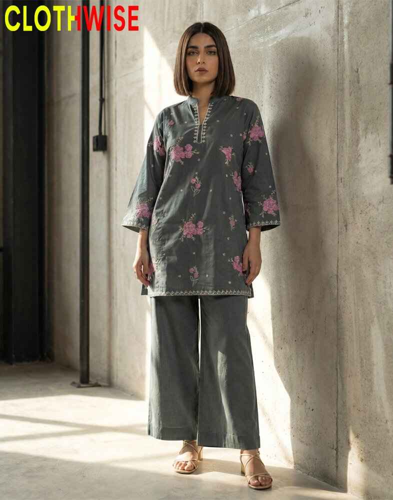 Woman wearing a gray floral outfit with 'CLOTHWISE' branding in the corner.