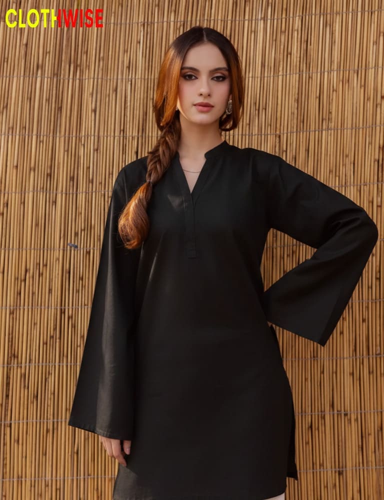 Woman wearing a black outfit against a bamboo wall with 'Clothwise' branding.