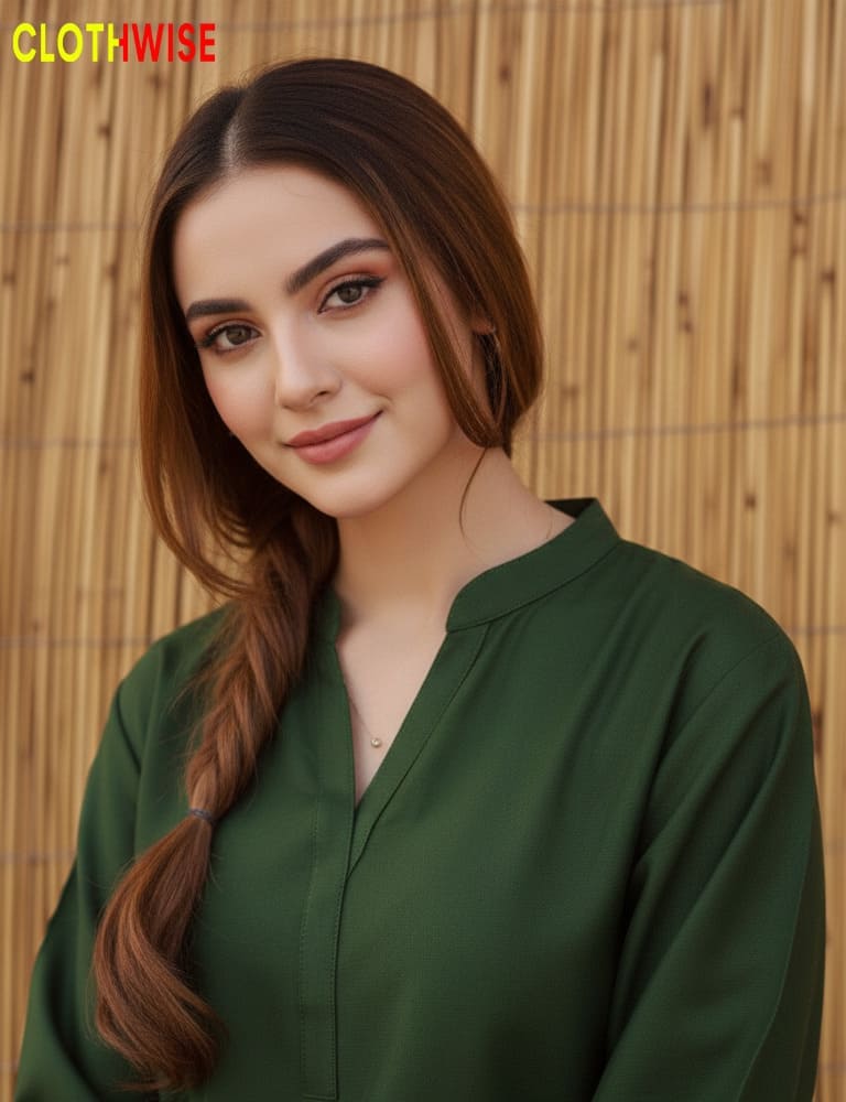 Woman wearing a green shirt with a wooden background, featuring the 'Clothwise' brand.