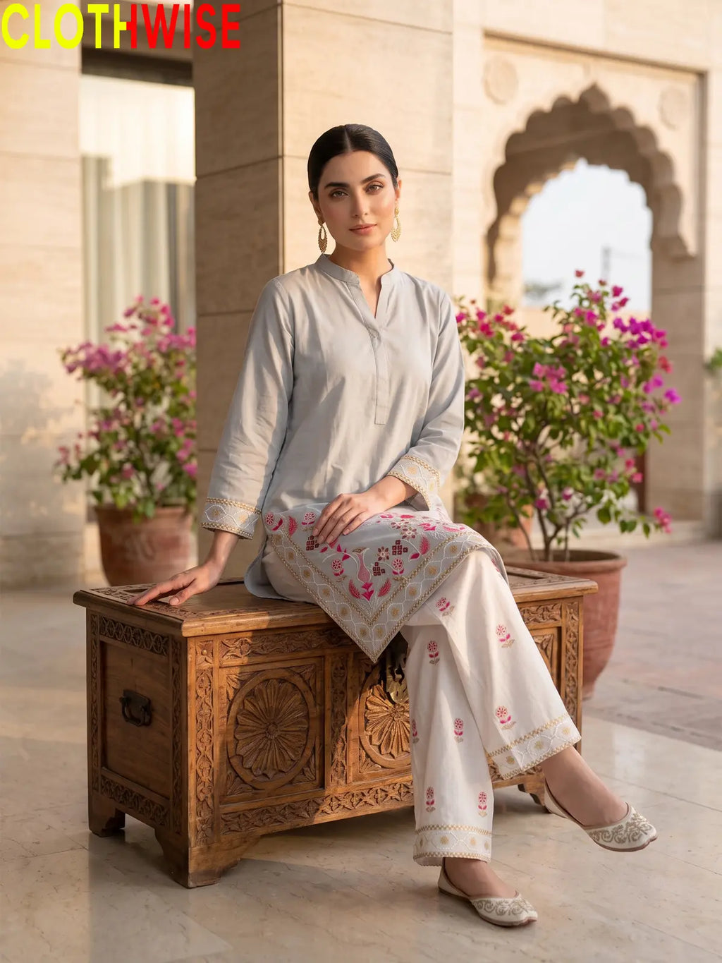Shajar Ice Blue embroidered cotton suit sitting pose
