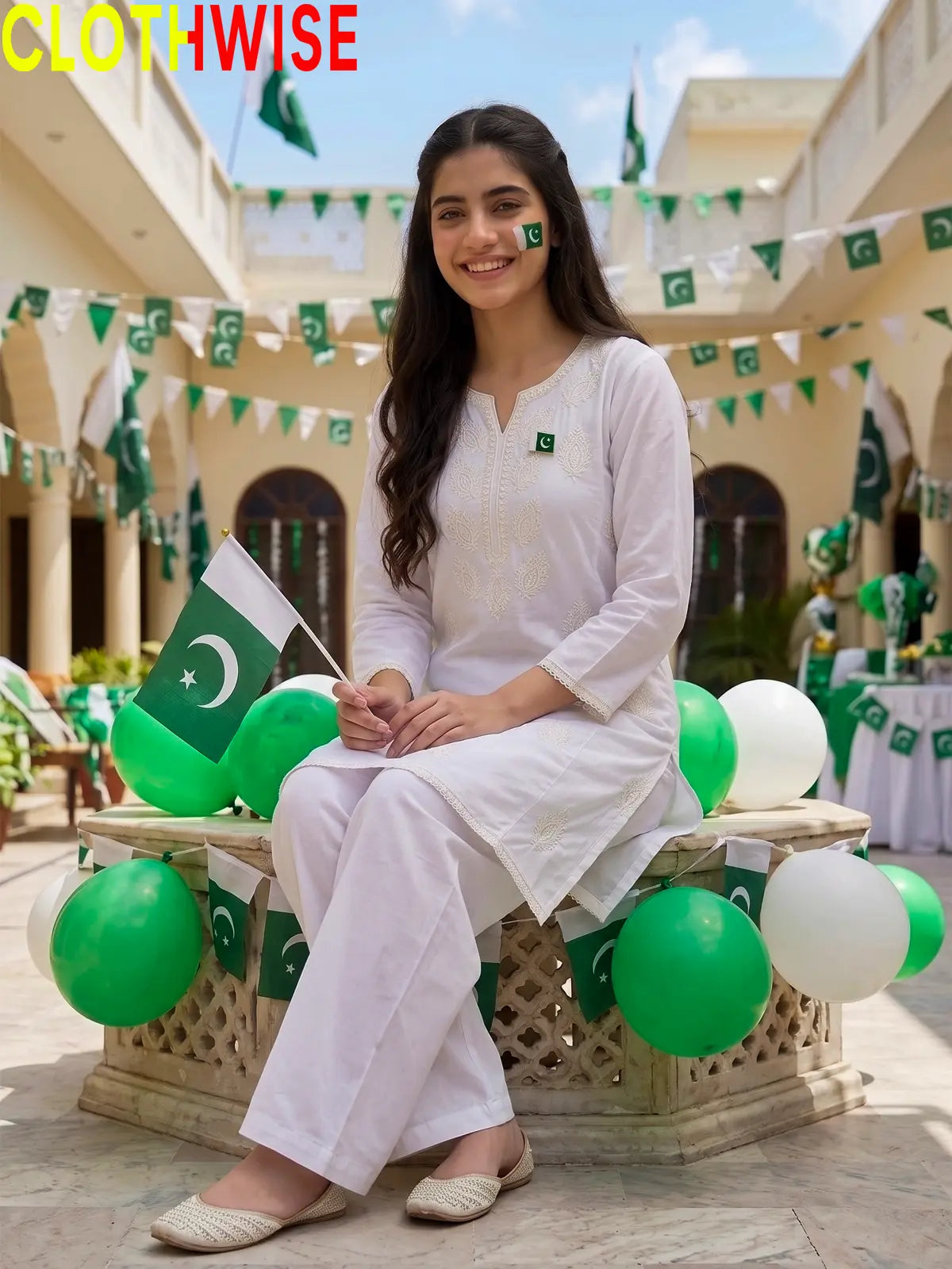 Model sitting in Azadi Indian Whitework Embroidered 2-piece lawn suit