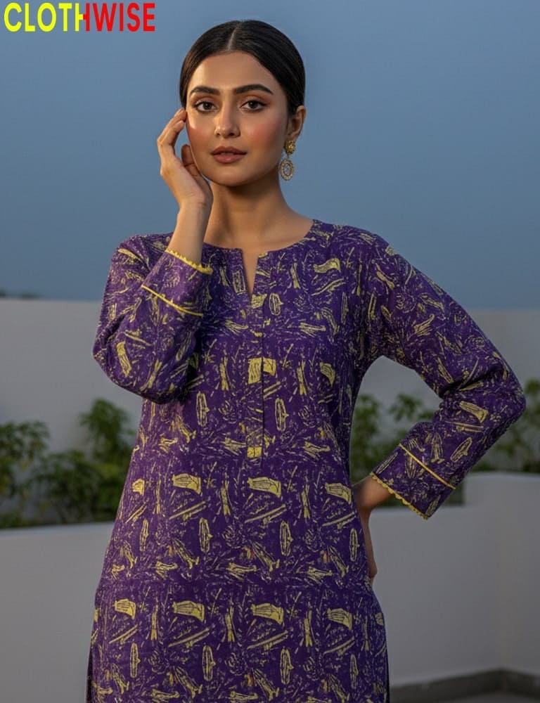 Woman wearing a purple patterned dress with a blurred outdoor background