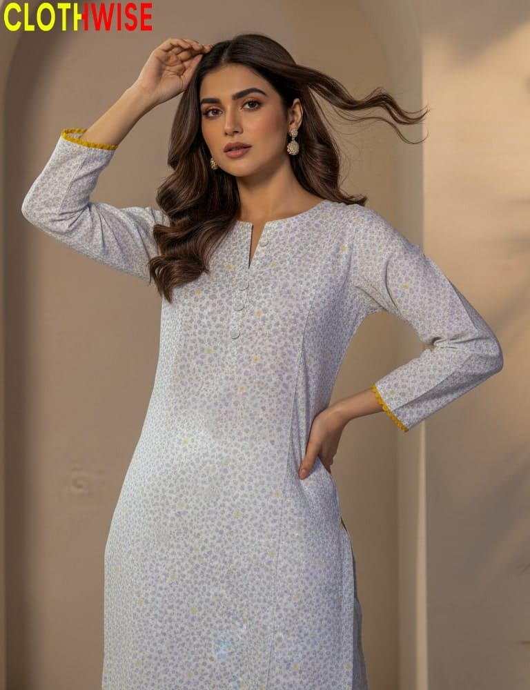 Woman wearing a light blue patterned dress with long sleeves against a beige background, with 'CLOTHWISE' branding.
