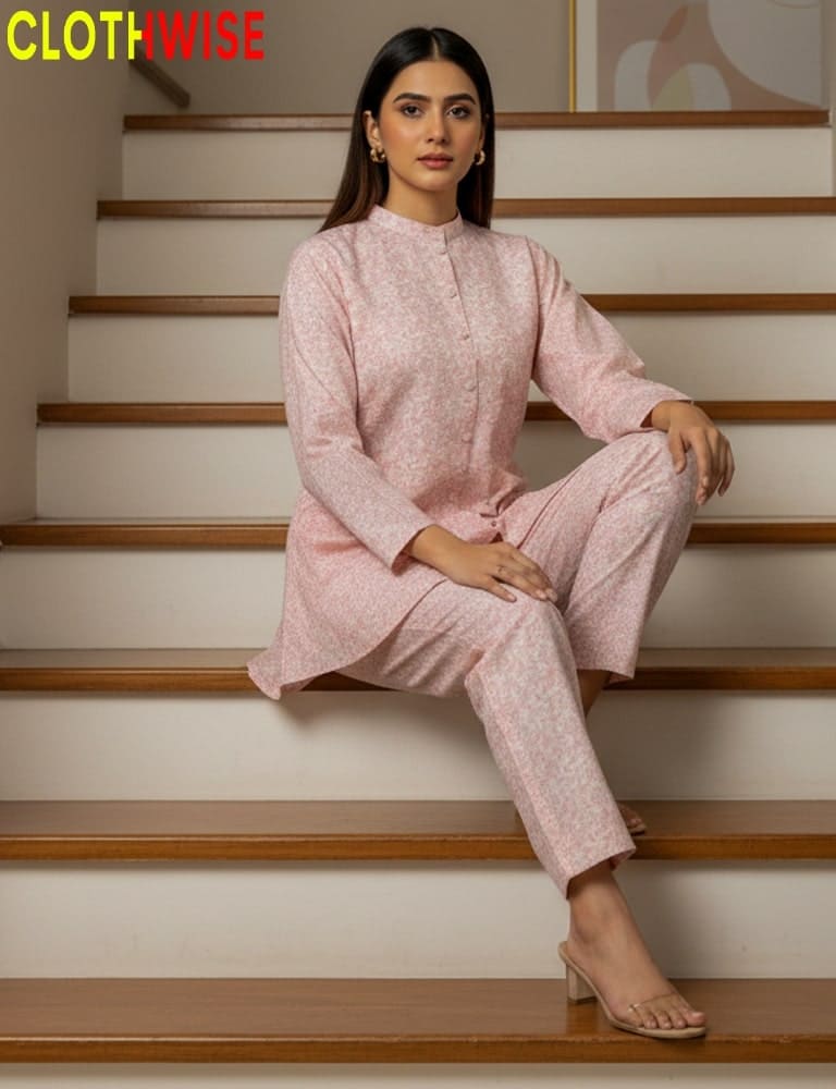 Woman in a pink outfit sitting on stairs with 'ClothWise' branding.