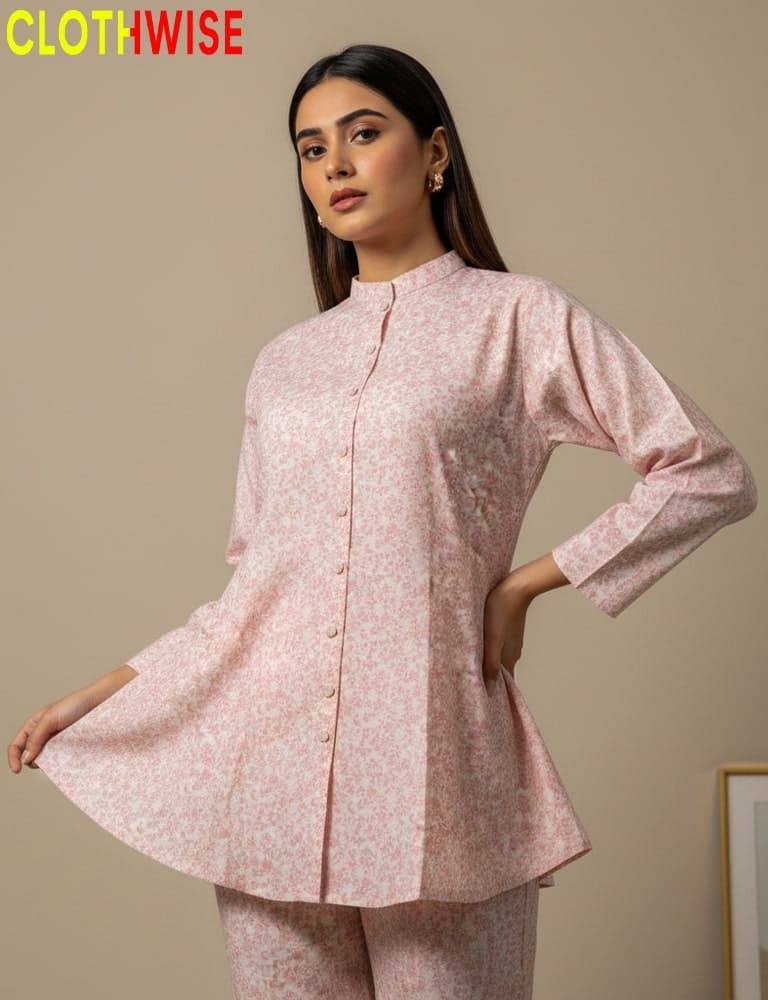 Woman wearing a pink patterned outfit with 'Clothwise' branding.