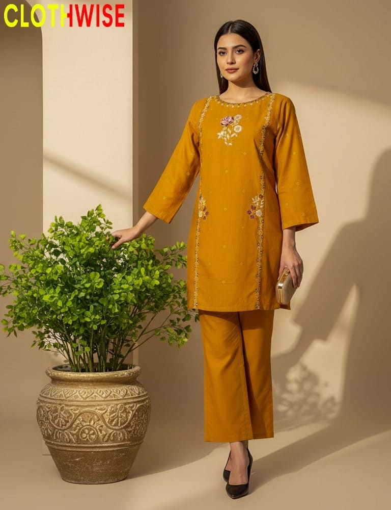 Woman in mustard yellow outfit standing next to a potted plant with 'CLOTHWISE' branding.