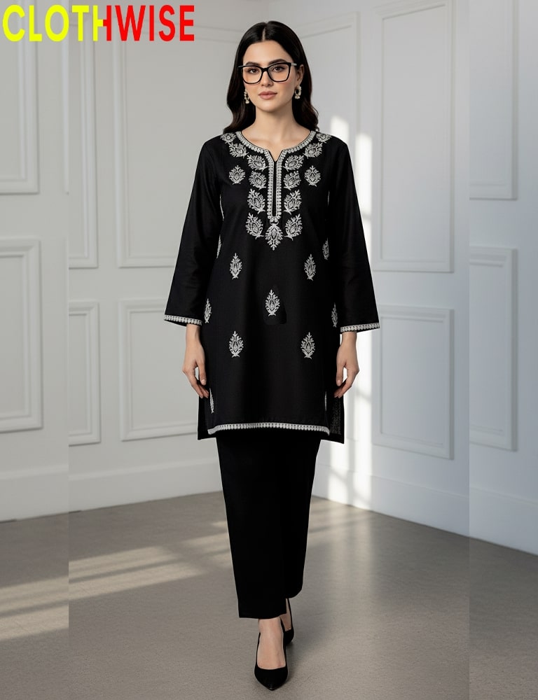 Woman wearing a black embroidered outfit with 'CLOTHWISE' branding.