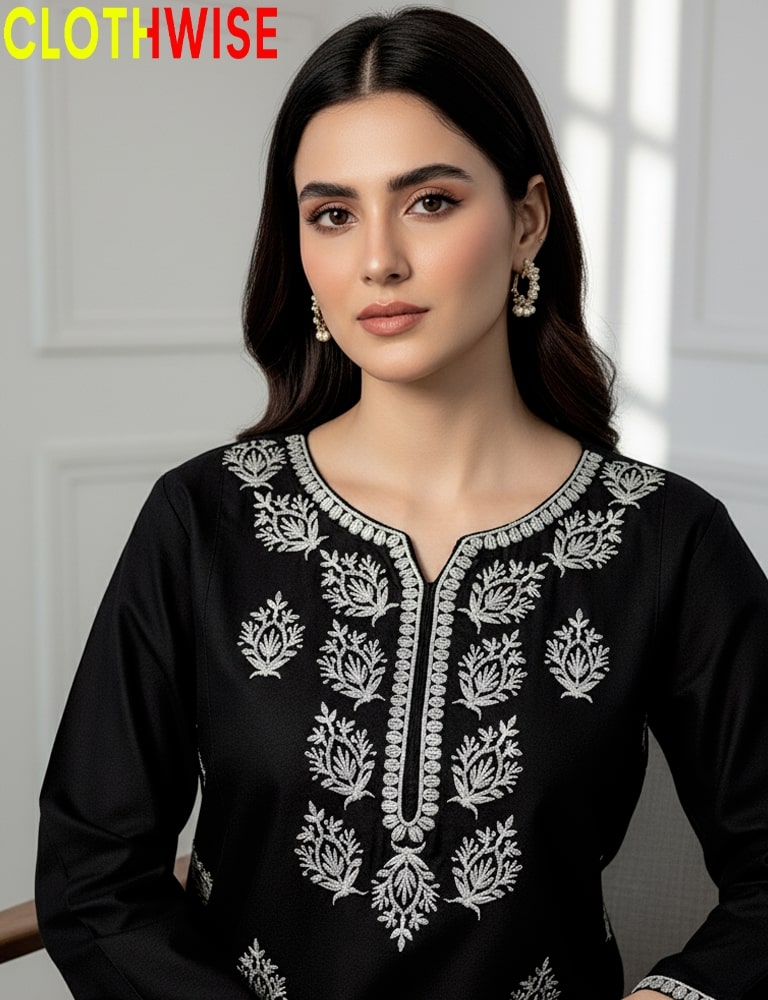 Woman wearing a black embroidered top with a white background, branded 'CLOTHWISE'.