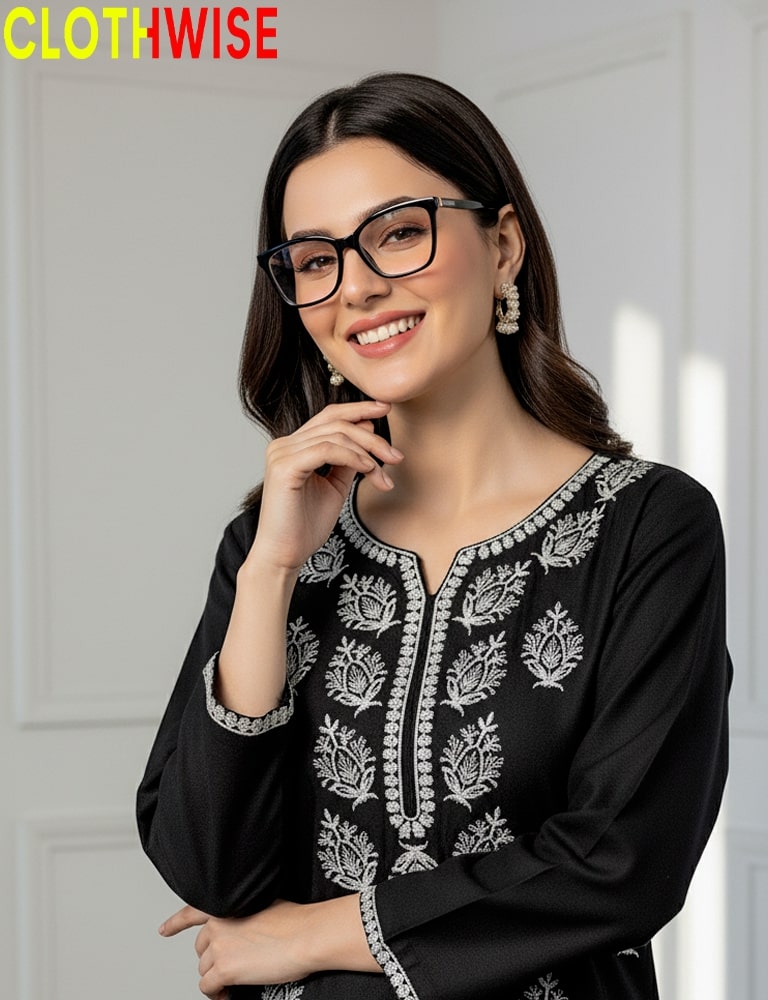 Woman wearing a black embroidered top with a white background, featuring the brand 'CLOTHWISE'.