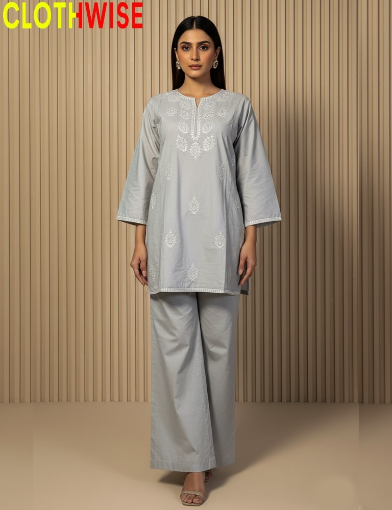 Woman wearing a light gray traditional outfit with floral patterns against a beige background, branded 'CLOTHWISE'.