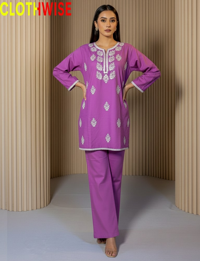 Woman wearing a purple embroidered outfit with 'CLOTHWISE' branding.