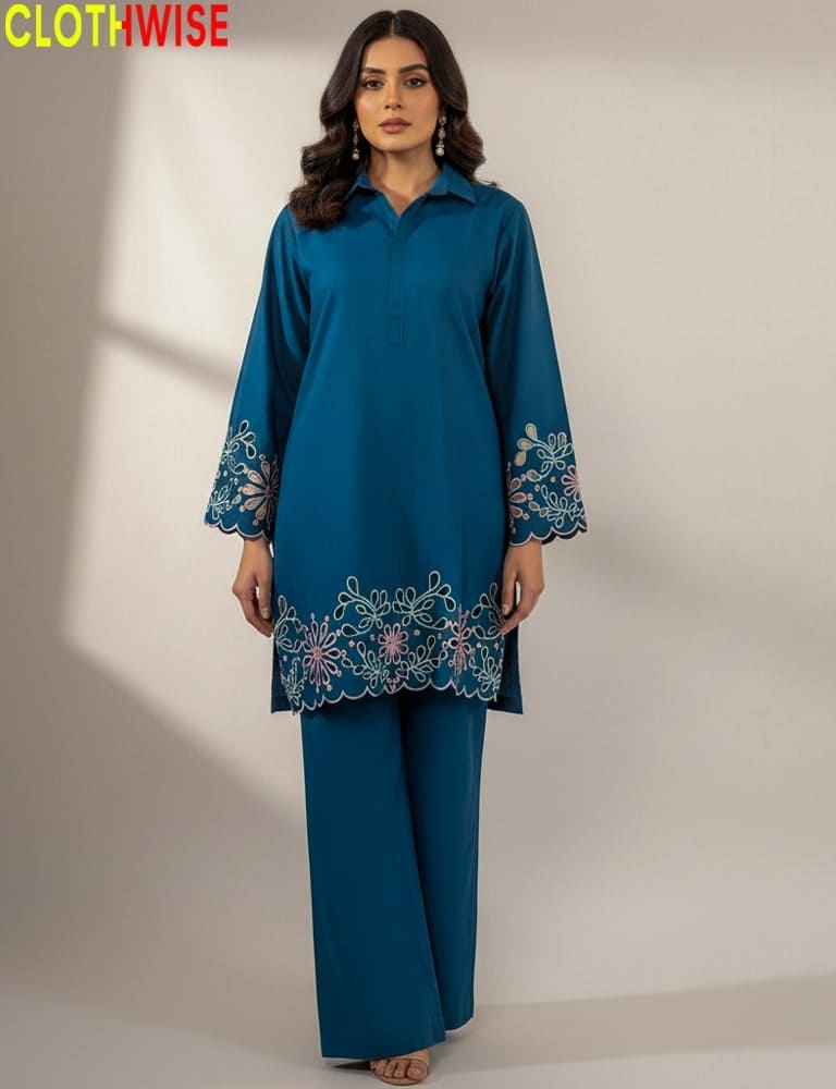 Woman wearing a teal outfit with embroidery, standing against a plain background with 'CLOTHWISE' branding.