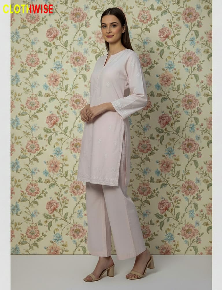 Woman wearing a light pink kurta with pants against a floral wallpaper background, with 'CLOTHWISE' branding.