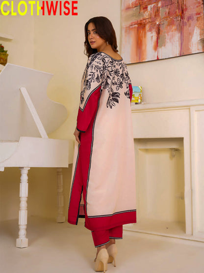 Woman wearing a red and white outfit with floral patterns in a room with a piano and abstract painting.