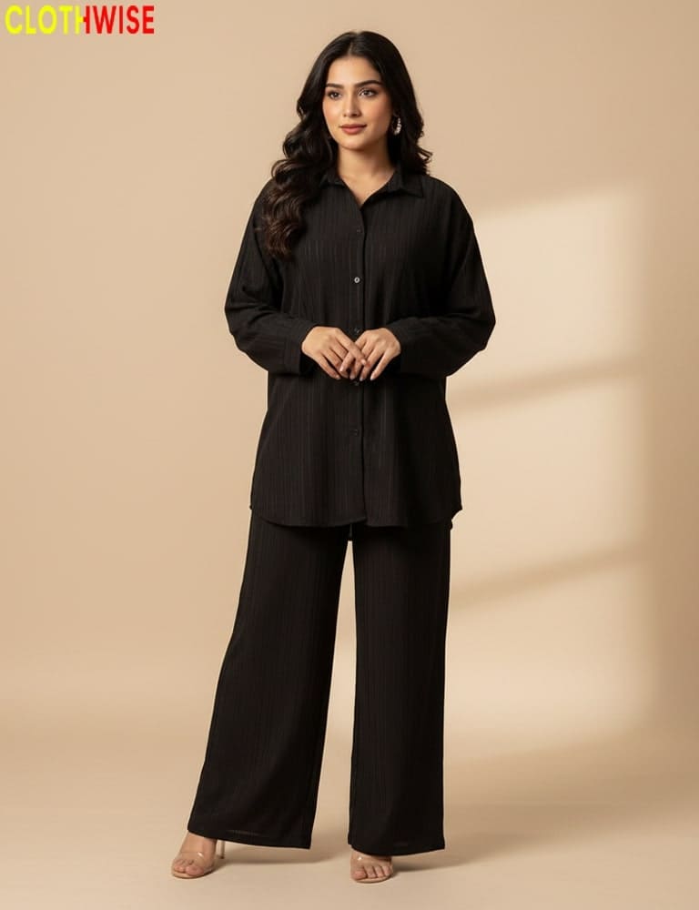 Woman wearing a black outfit on a beige background with 'CLOTHWISE' branding.