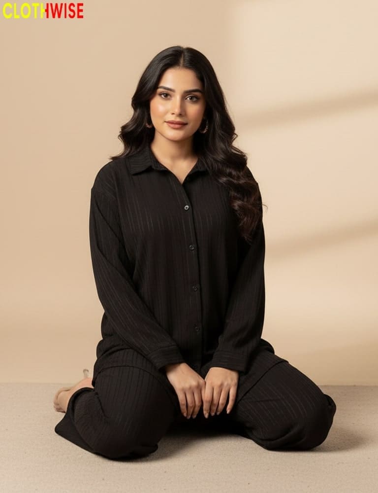 Woman wearing a black outfit sitting on a beige background with 'CLOTWWISE' branding.