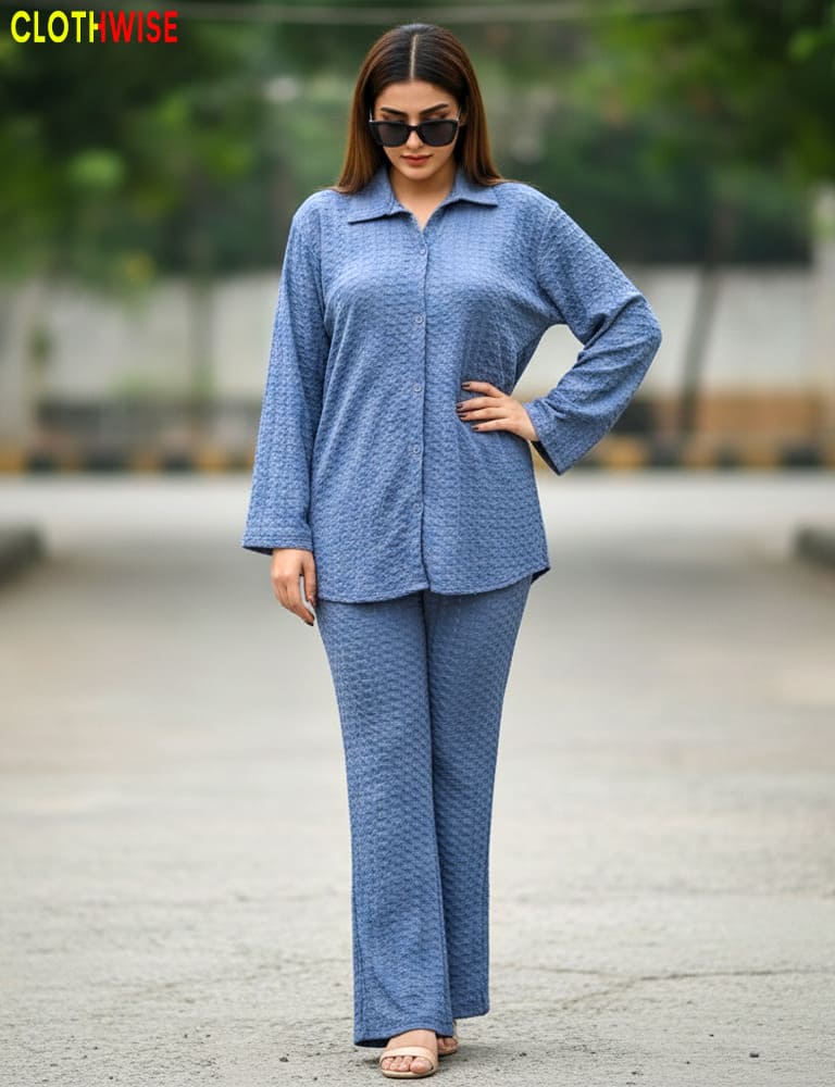 Woman wearing a blue outfit with sunglasses outdoors, branded 'Clothwise'.