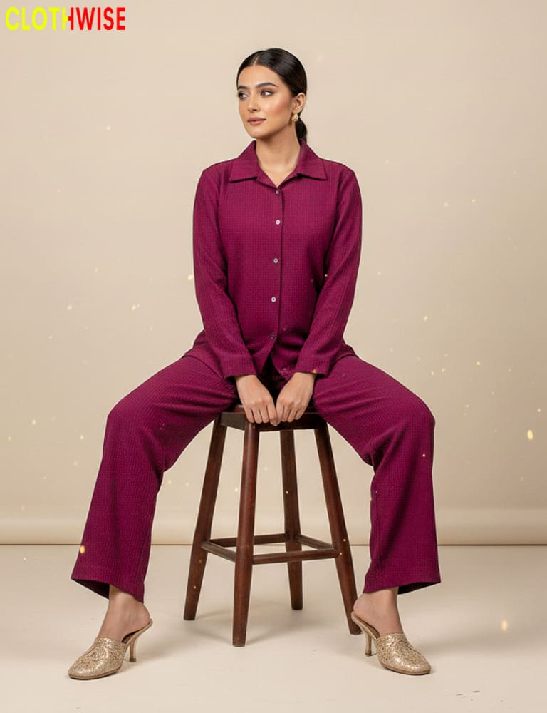Woman wearing a magenta outfit sitting on a stool with 'ClothWise' branding.