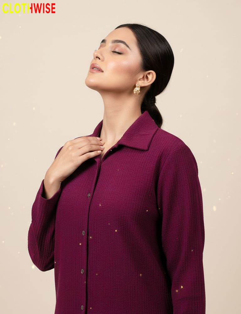 Woman wearing a purple shirt with a neutral background, featuring the brand 'Clothwise'.