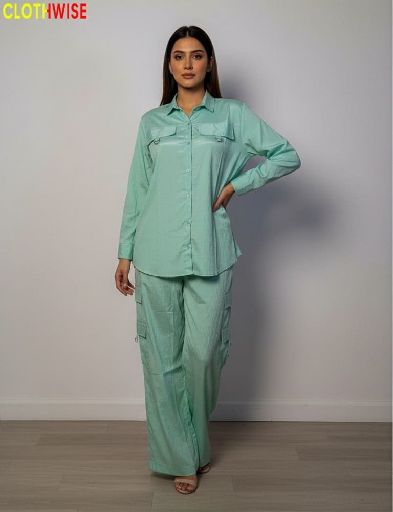 Woman wearing a light green outfit with 'CLOTHWISE' branding.