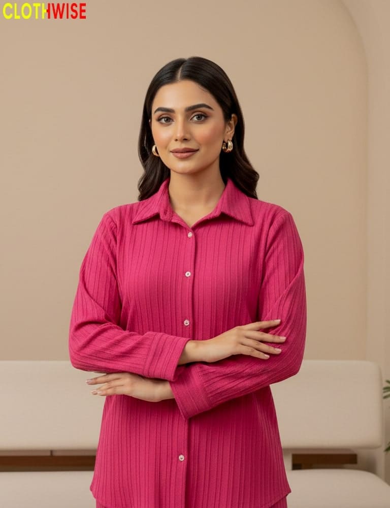 Woman wearing a pink pleated shirt against a beige background with 'CLOTHWISE' branding.