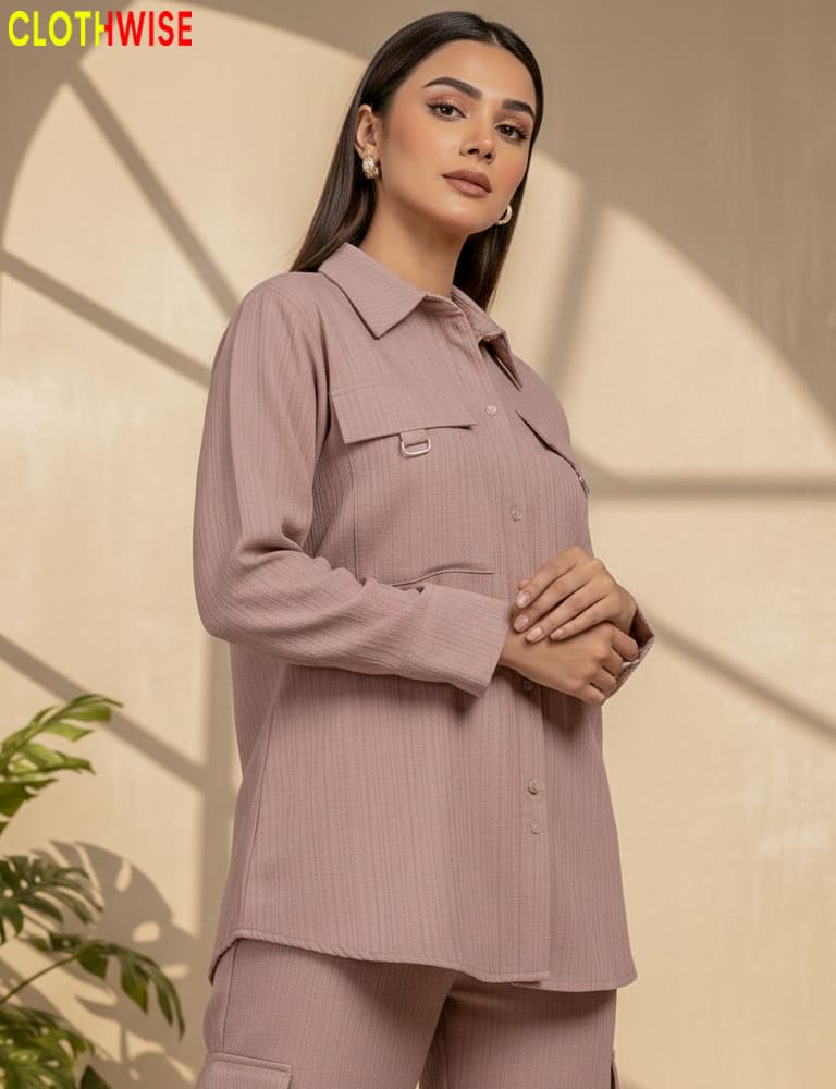 Woman wearing a mauve shirt and pants with a beige background, featuring the 'Clothwise' brand.