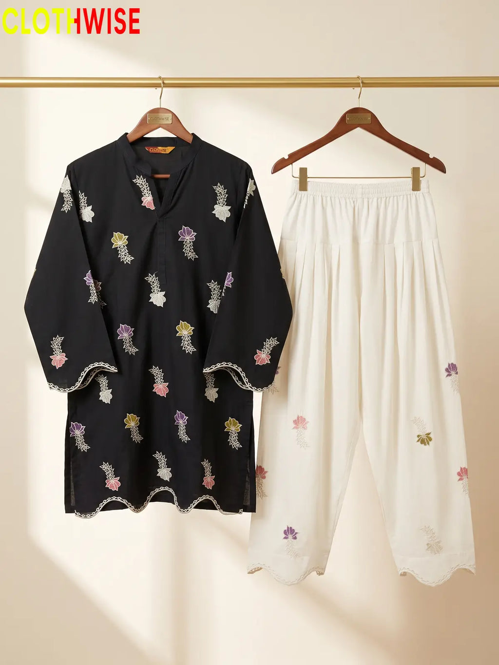Khushi embroidered cotton suit in Malaysian Black - hanger view