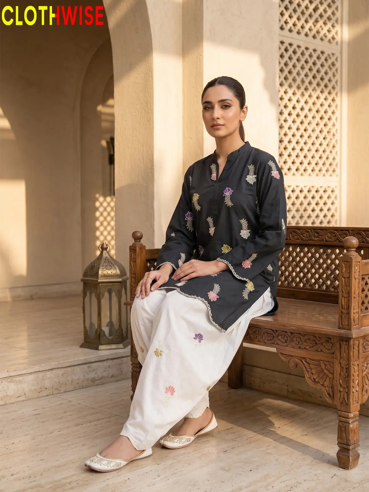 Khushi embroidered cotton suit in Malaysian Black - sitting view