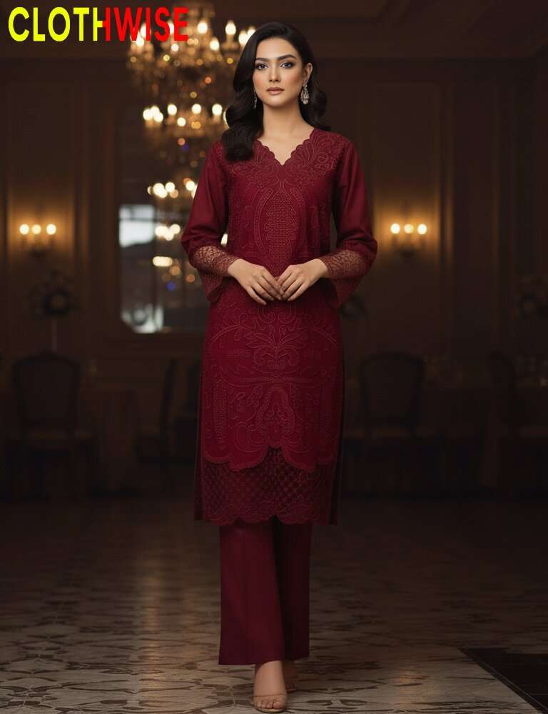 Woman wearing a maroon lace outfit in an elegant indoor setting with 'CLOTHWISE' branding.