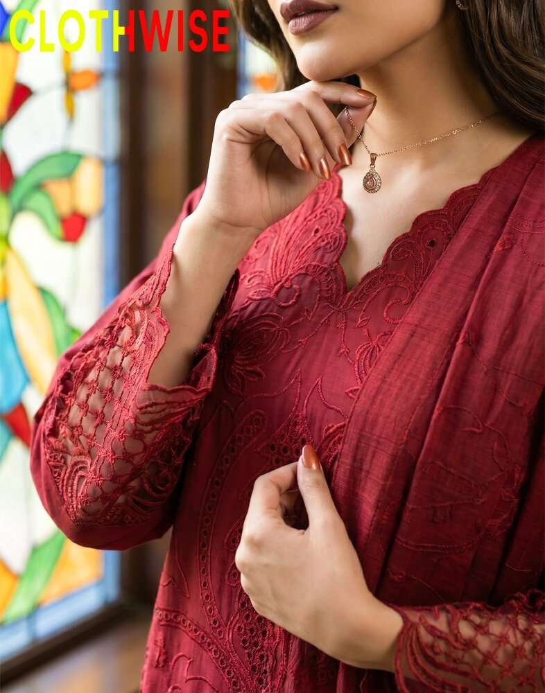 Red lace top worn by a person with a colorful stained glass window in the background