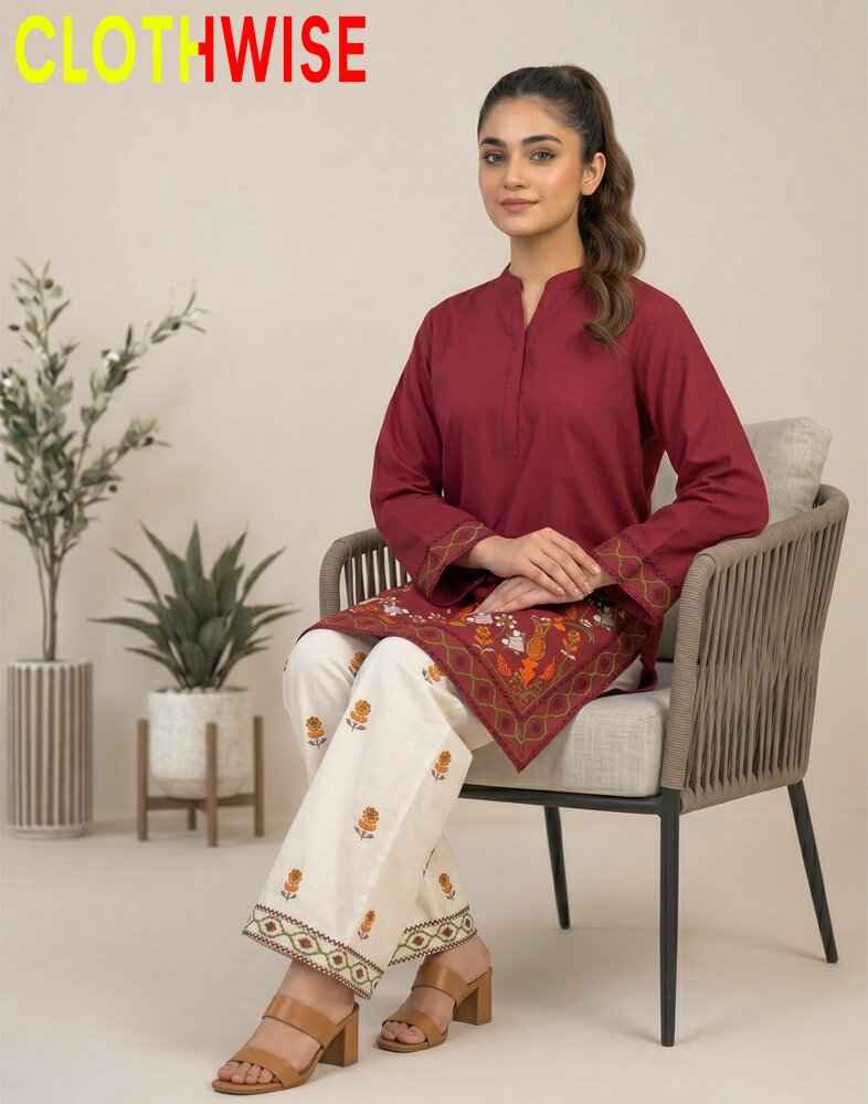 Woman sitting on a chair wearing a maroon top and white pants with patterns, with 'CLOTHWISE' branding.