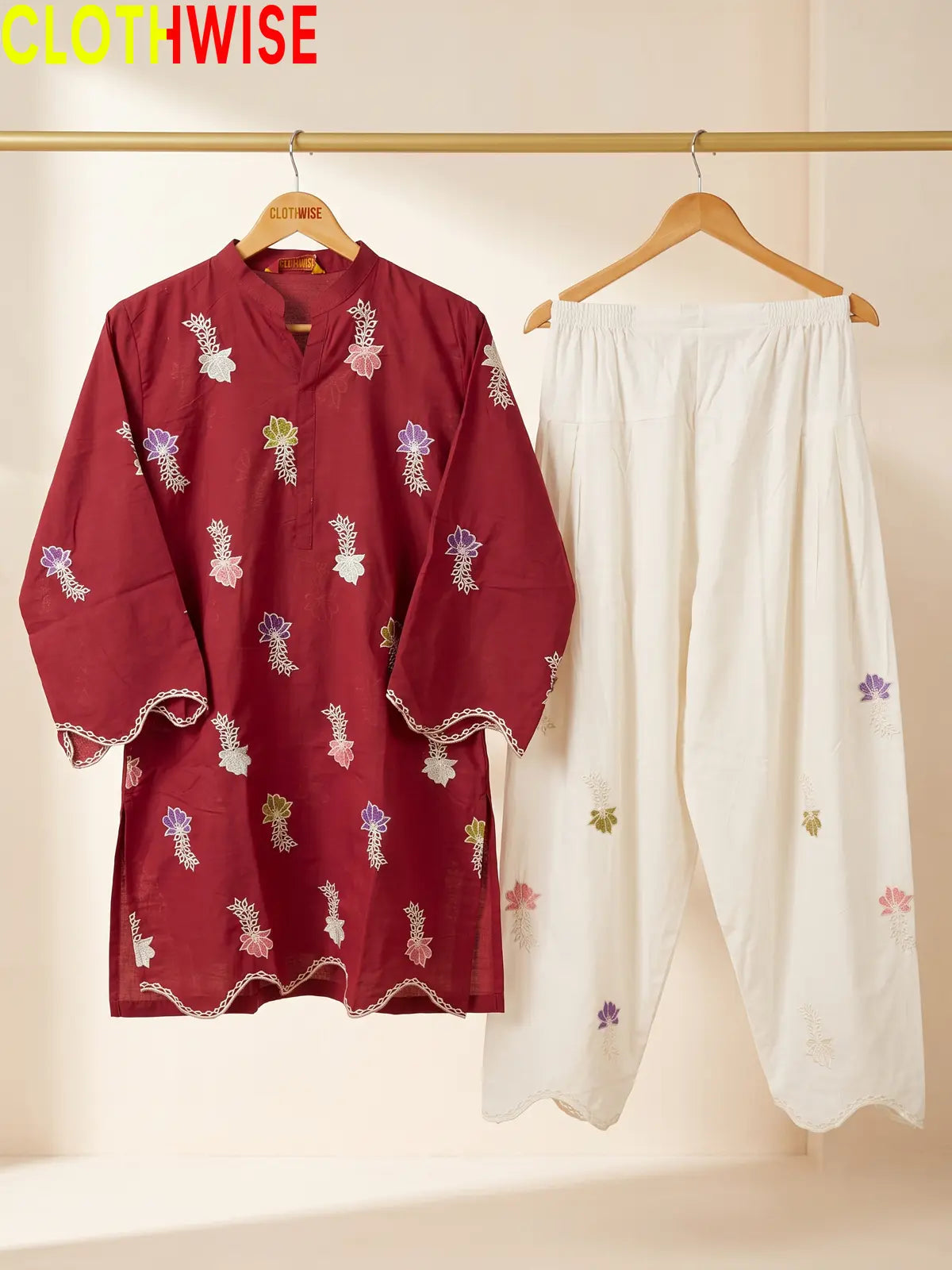 Khushi embroidered cotton suit in Maroon - hanger view