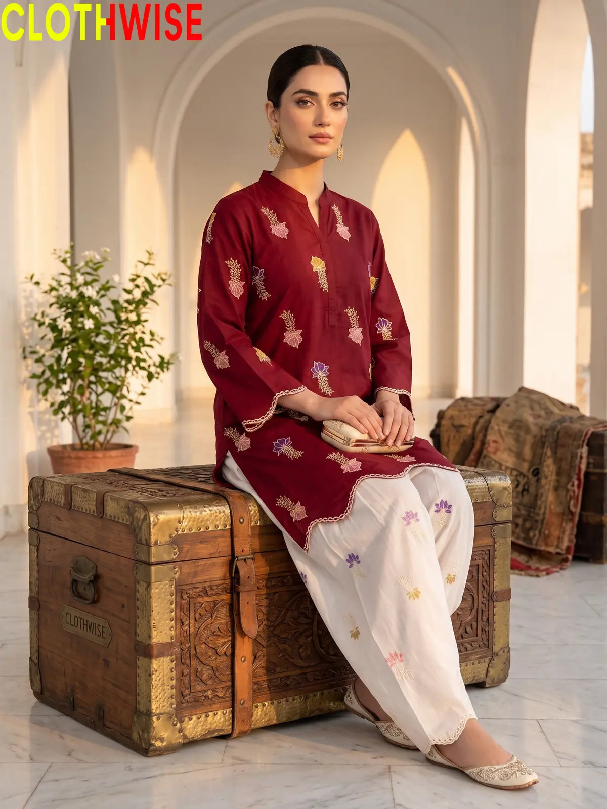 Khushi embroidered cotton suit in Maroon - sitting view