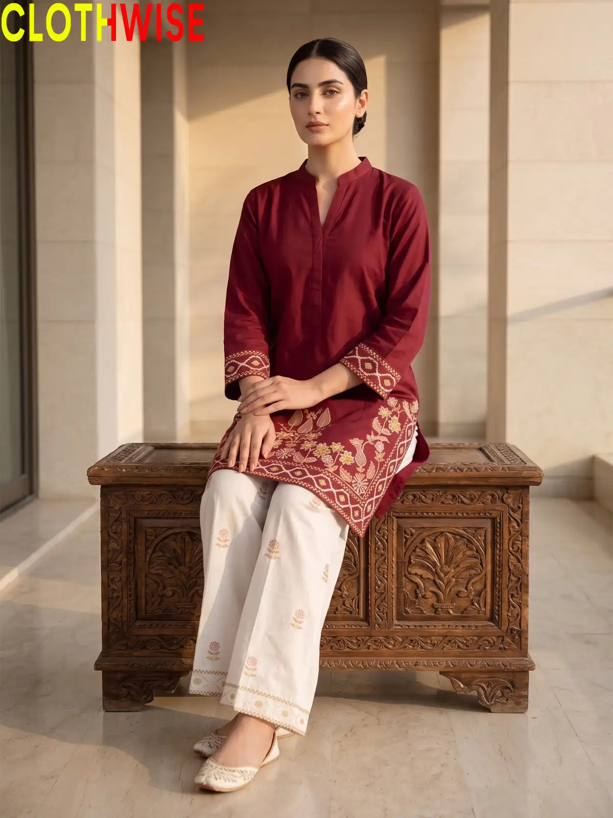 Shajar Maroon embroidered cotton suit sitting pose